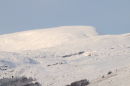 Looking at the summit of The Merrick in snow