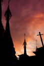 Silhouettes against sunset sky