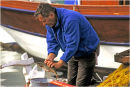 George cleaning fish