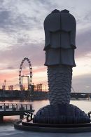 Merlion And Singapore Flyer At Dawn
