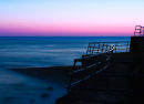 Railings with a pink sunset