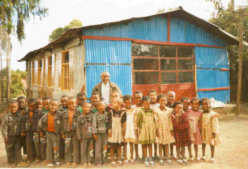 Mr Worku with Grade 1 in their uniforms (2007)