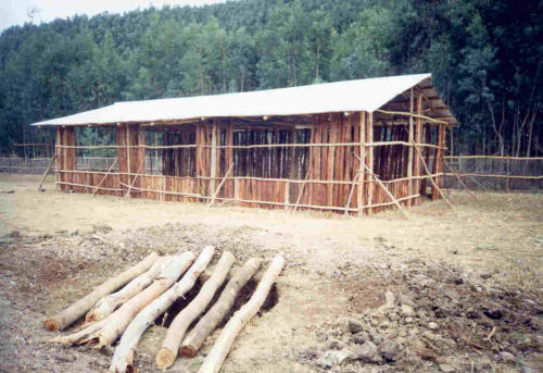 classroom and pit latrine under construction