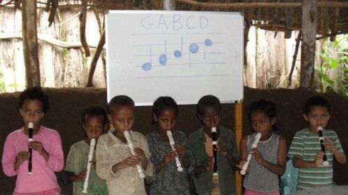 Grade 1s practise playing the recorder