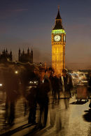 People on Westminster Bridge with the Houses of parliament behind