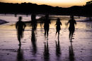 Children running on a beach
