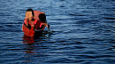Child in home-made boat on the River Nile