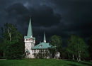 Storm clouds over church in Jokkmokk