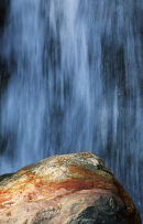 Waterfall and boulder