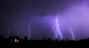 Lightning display over a lone house