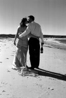 Wedding-Couple Stroll along Surf Bay.