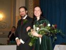 Kate is carrying an Overarm  Handtied Bouquet 