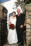 Hand-tied bouquet of red roses and greenery