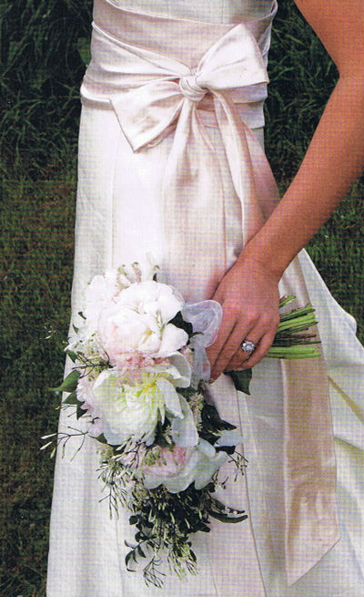 Small shower bouquet of pale pink and cream peonies