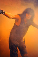 Martin Cornish as Alice emerges through the smoke from the executioners chair