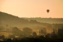 A balloon drifts in the evening light across watermeadows at Bathampton, UK. 2009
