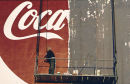 A man removes an advert for Coca-Cola in Istanbul, Turkey.
1997