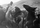 Tajikistan, 1998. Horsemen engage in a game of buzcashi - a goat carcass is fought over - goals are scored by dropping the carcass at a point on the pitch.