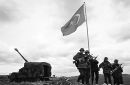 Northern Iraq, 1995.
Turkish Forces raise their flag after invading Iraqi territory in pursuit of Kurdish guerrillas of the PKK.