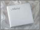 Ascot
Stylish padded traditional album.
White feather grained finish to the cover and to complete this pure look, the word 'Wedding' is embossed on the top left hand corner.