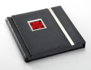 Madison (Black) New style of modern wedding album. Fresh modern styling, Madison features a wrap round magnetic cover, finished with silver trim. Available in a matt finish Black or White cover, each album has an aperture to display a print of your choice on the front cover.