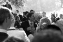 Wedding kiss - a photograph taken from over the shoulders of the wedding guests