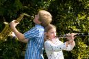 Siblings photographed with their clarinet and saxophone