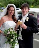 The bride and groom have a champagne moment