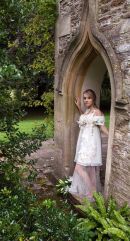 Fashion model photographed in doorway of bothy