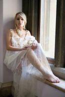 Striking model photographed in a windowsill