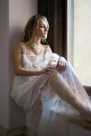 Photograph of a thoughtful model lit by the window