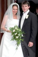 A traditional wedding photograph of the bride and groom