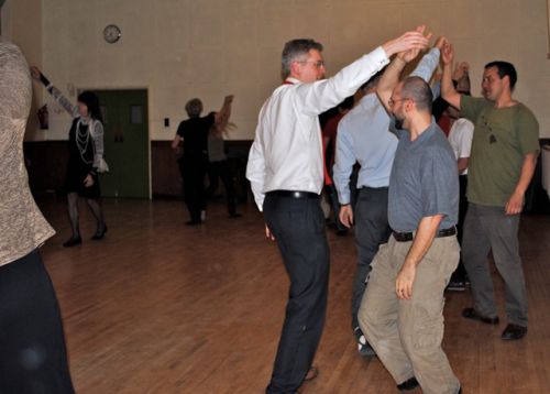 Turning under arm in the Gay Gordons.