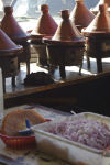 tagines cooking in roadside eatery_01