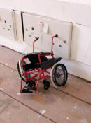 Untitled (red wheelchair)