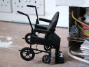 Untitled (black wheelchair)